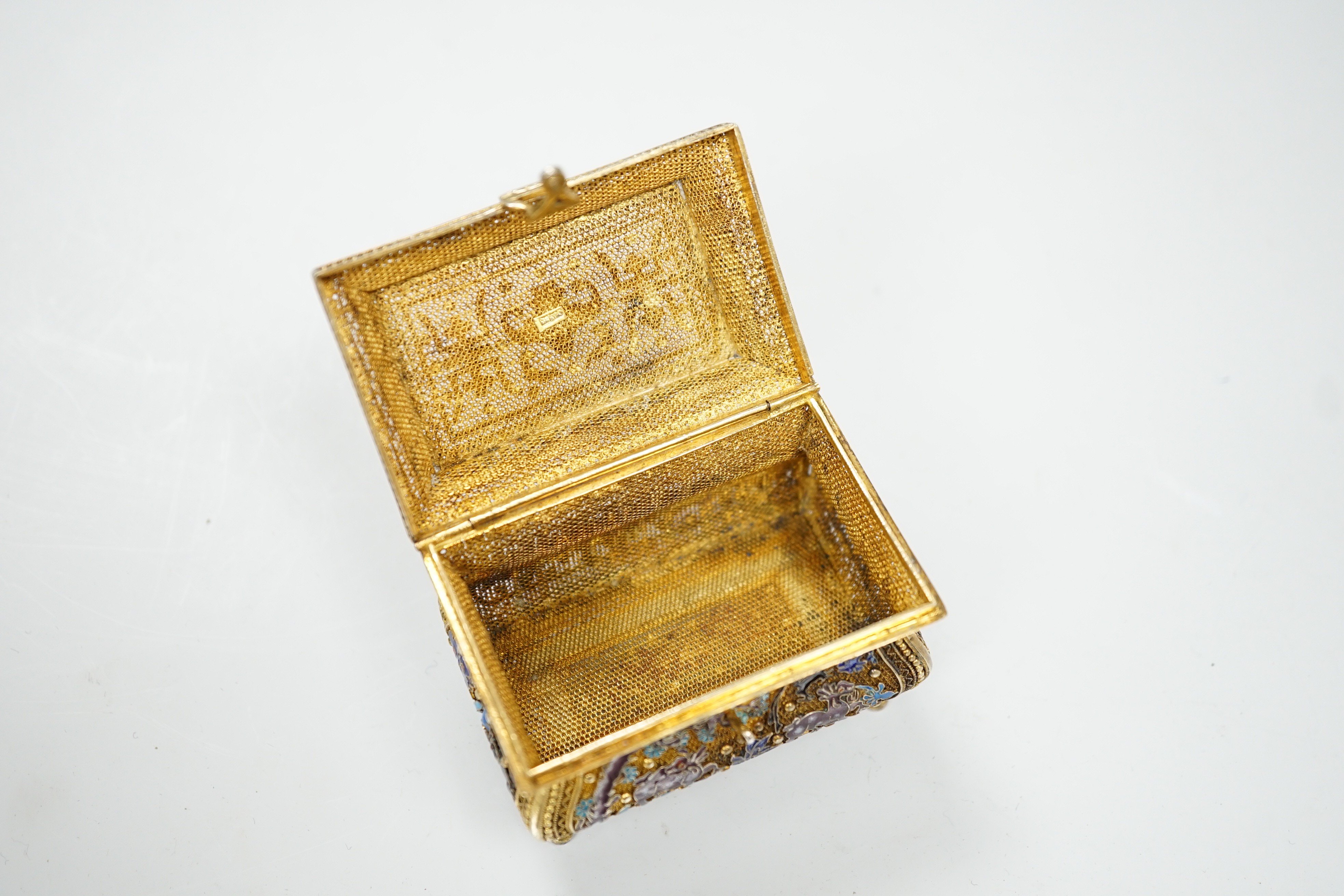 A Chinese gilded filigree white metal and enamelled trinket box, stamped 'silver', width 63mm, gross weight 76 grams.
